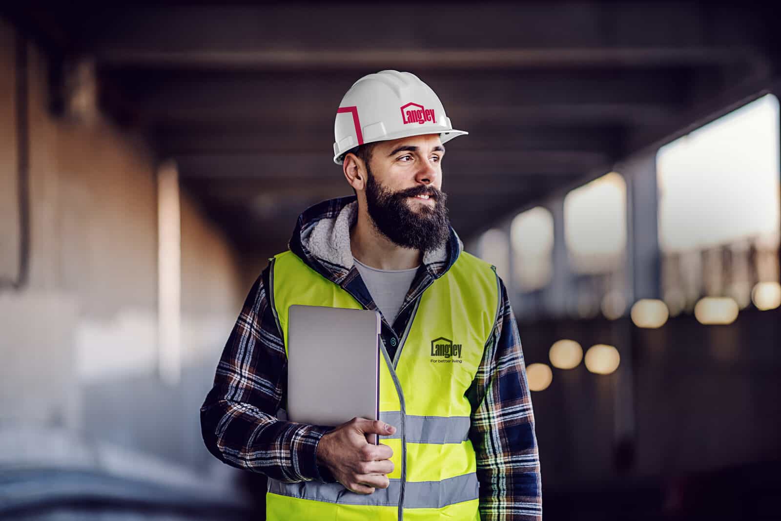 Experienced roofing operative in Langley workwear on site